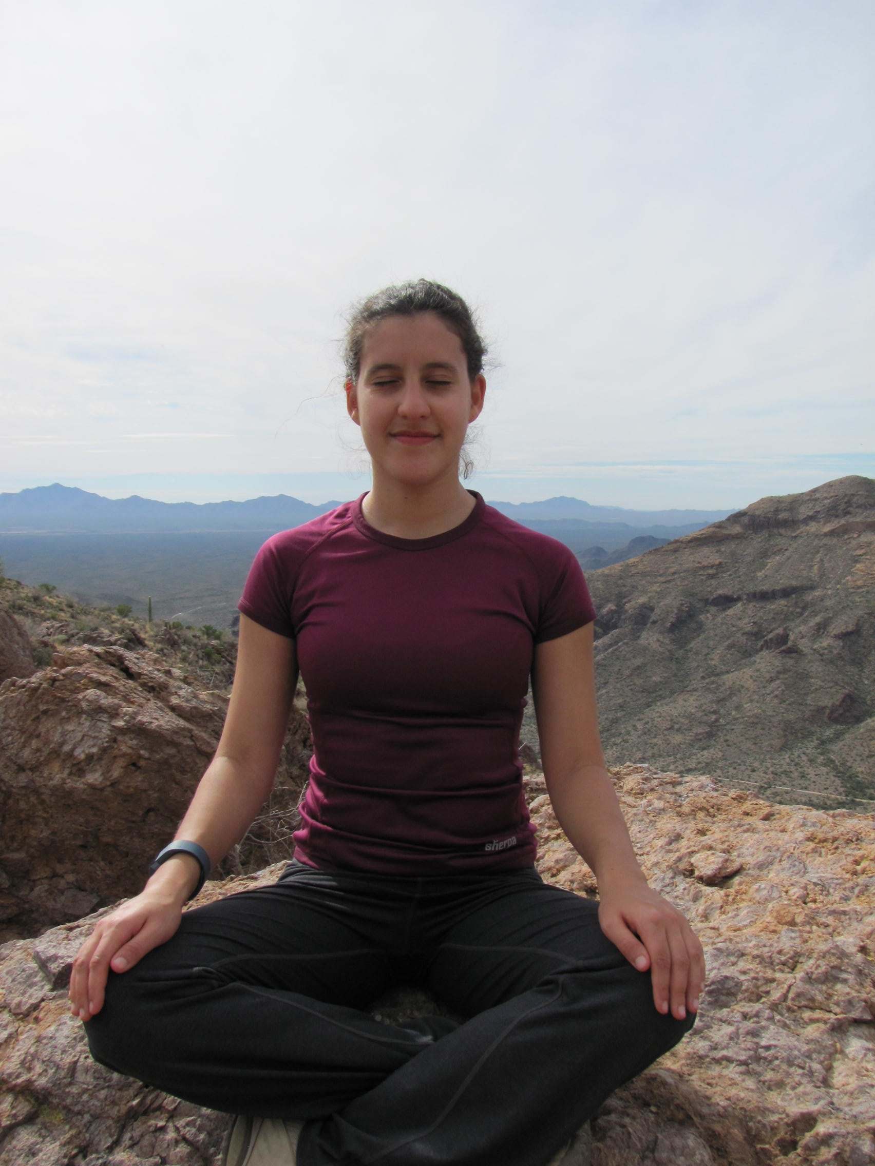 Sitting yoga pose on a mountain