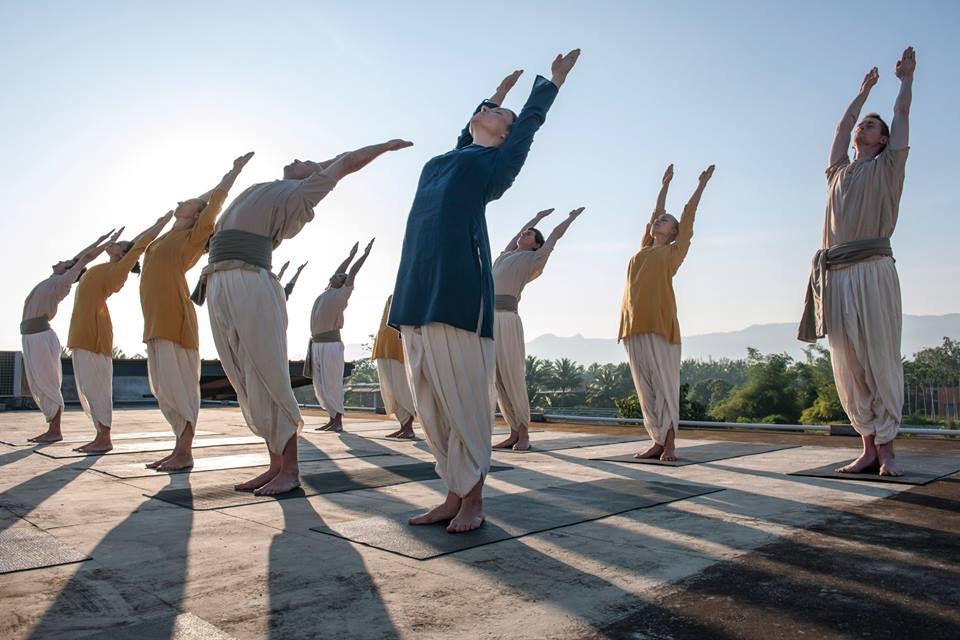 Group of Yogis practicing Surya Kriya